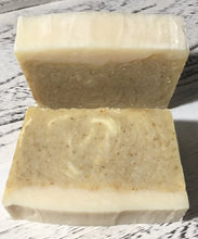 Load image into Gallery viewer, This Lemon Chamomile Vegan Handcrafted Soap is so soothing and especially designed for sensitive skin because of the colloidal oatmeal that it contains. The soft scent of lemon essential oil gives it a bright ,sweet &amp; refreshing scent, while coconut, olive &amp; sweet almond oils give it that luxurious lather.